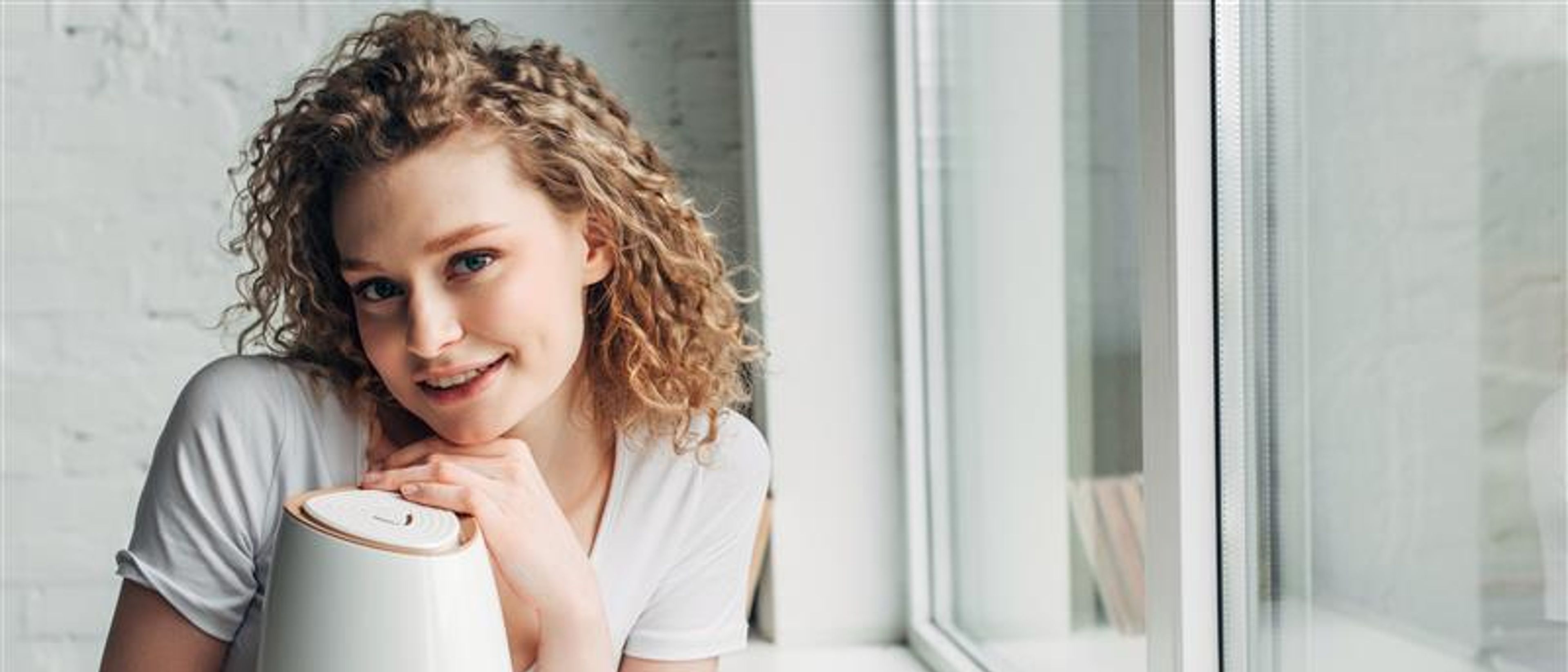 A woman with a purifier