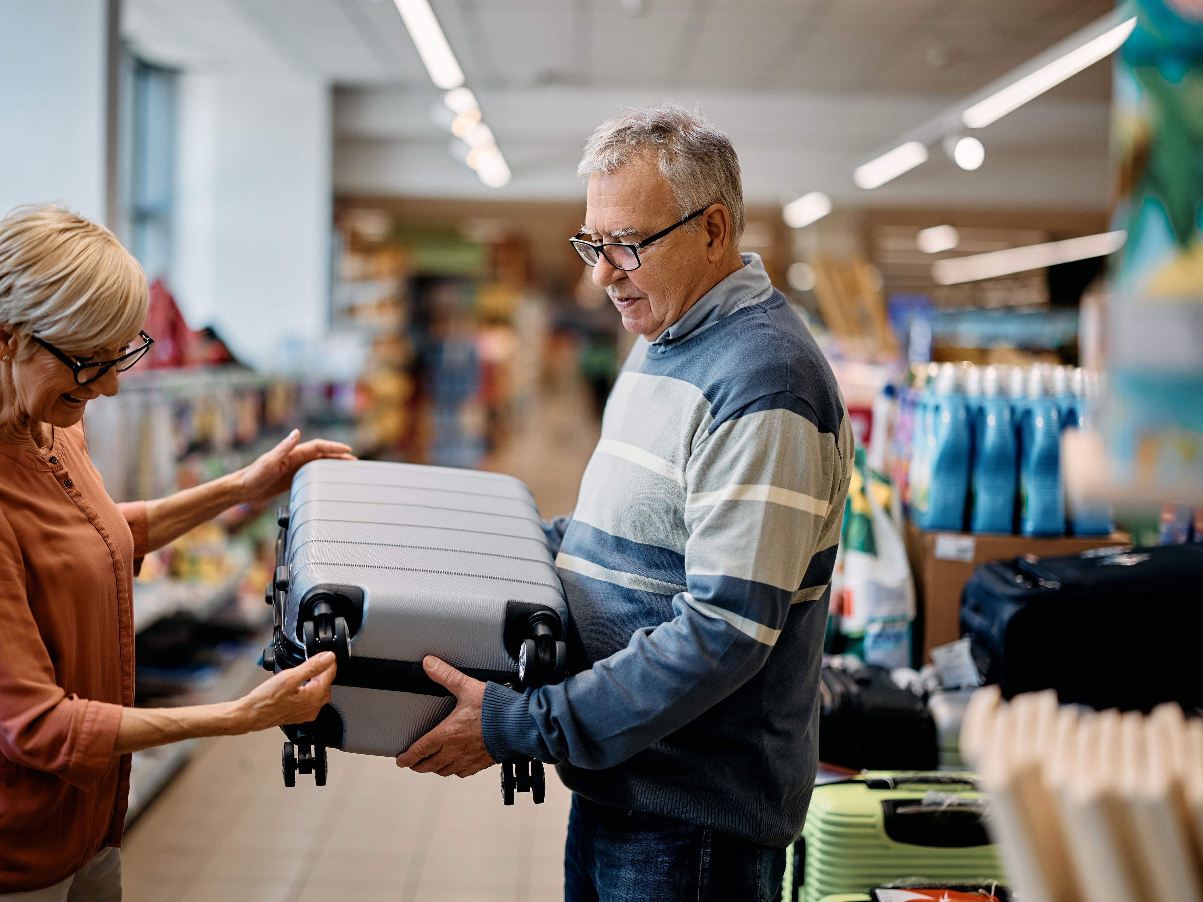 Couple holding cabin case