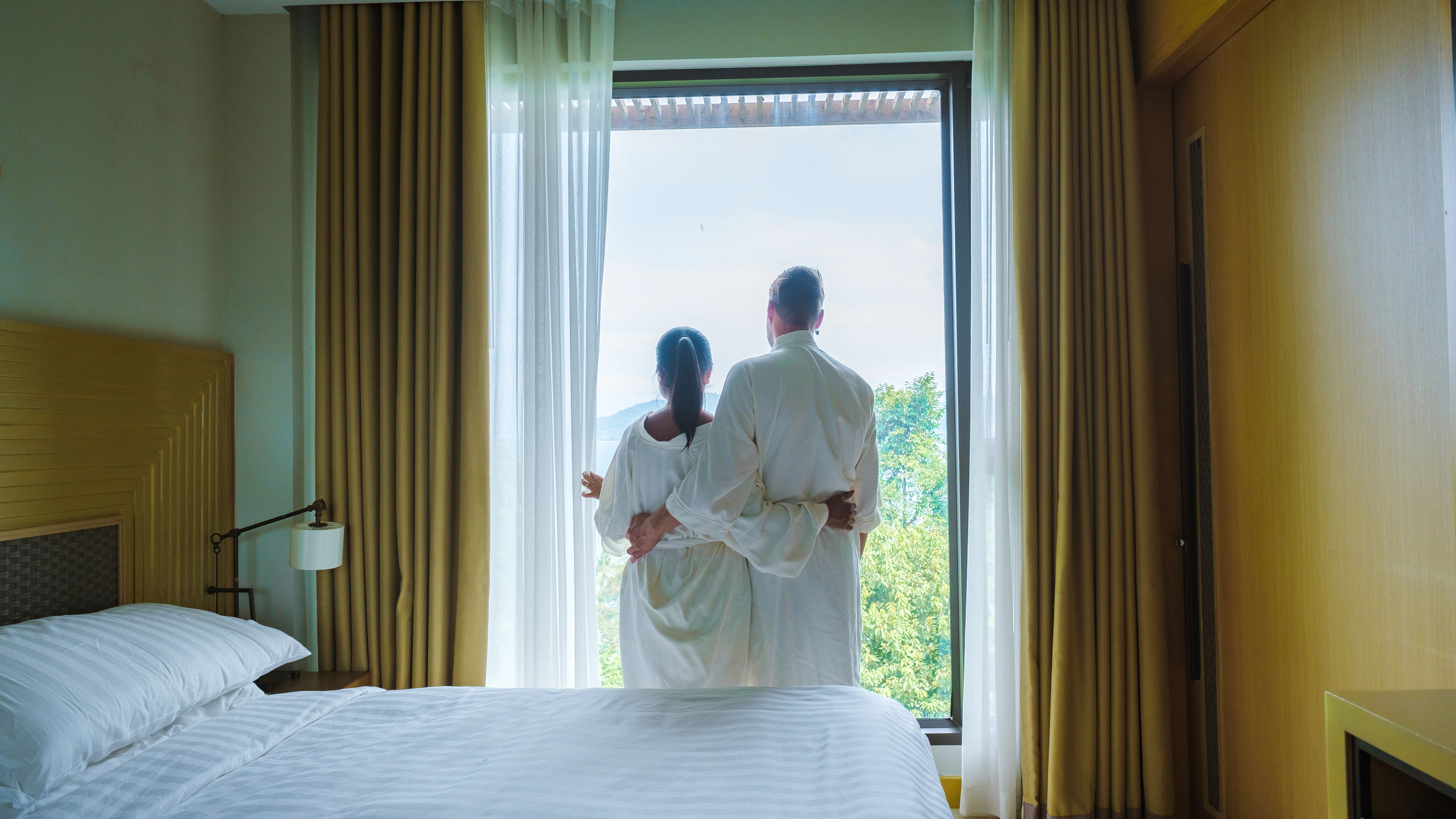 Couple looking out of the window.