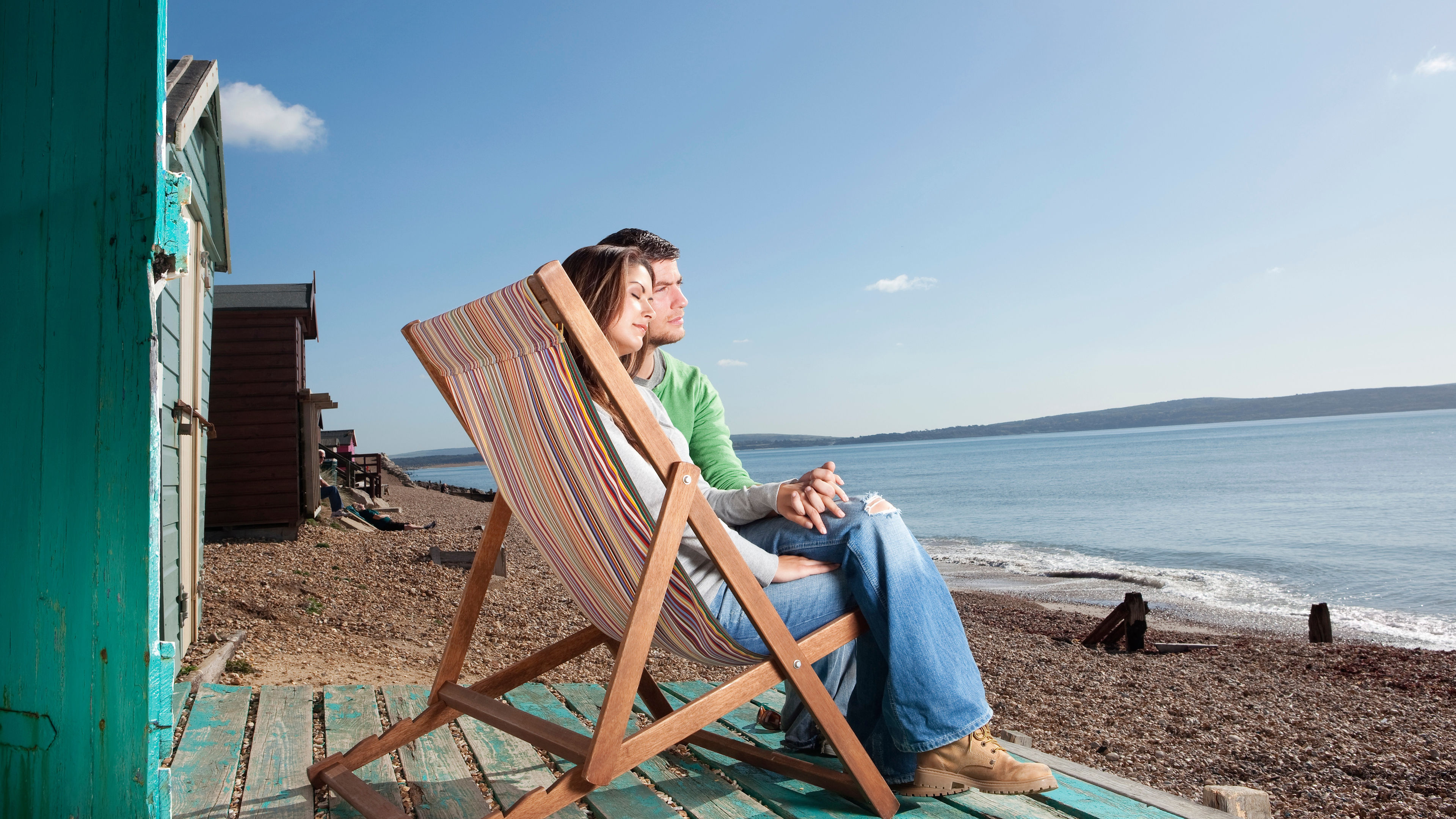 Couple relaxing by the beach