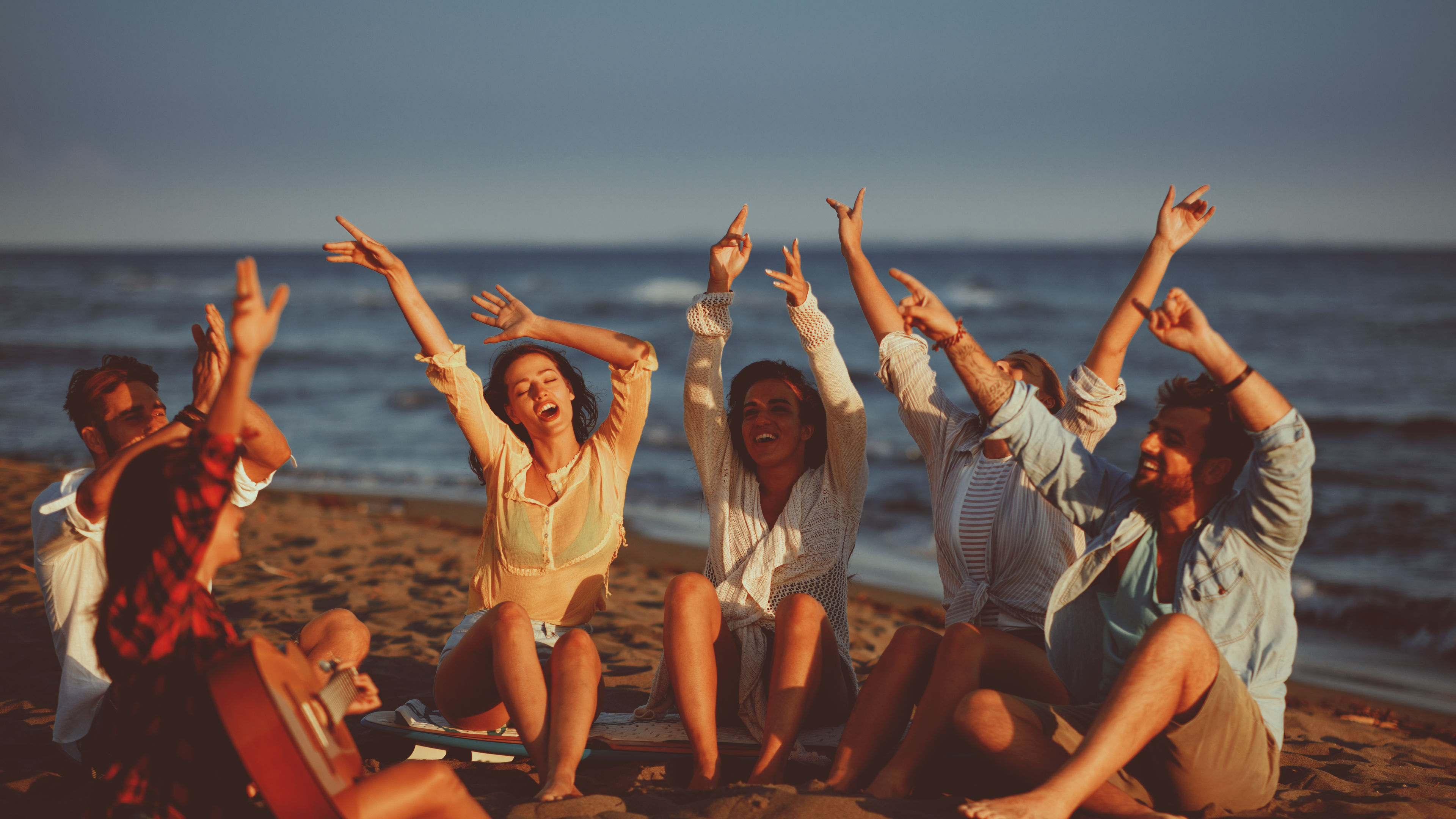 Friends enjoying on a beachside
