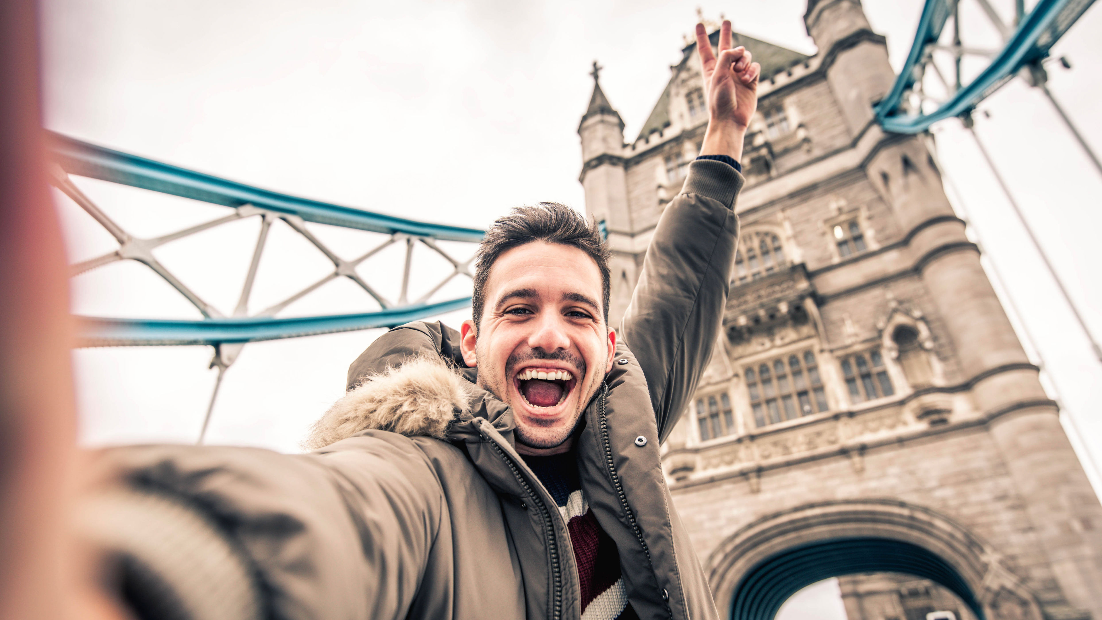 Man smiling and taking selfie