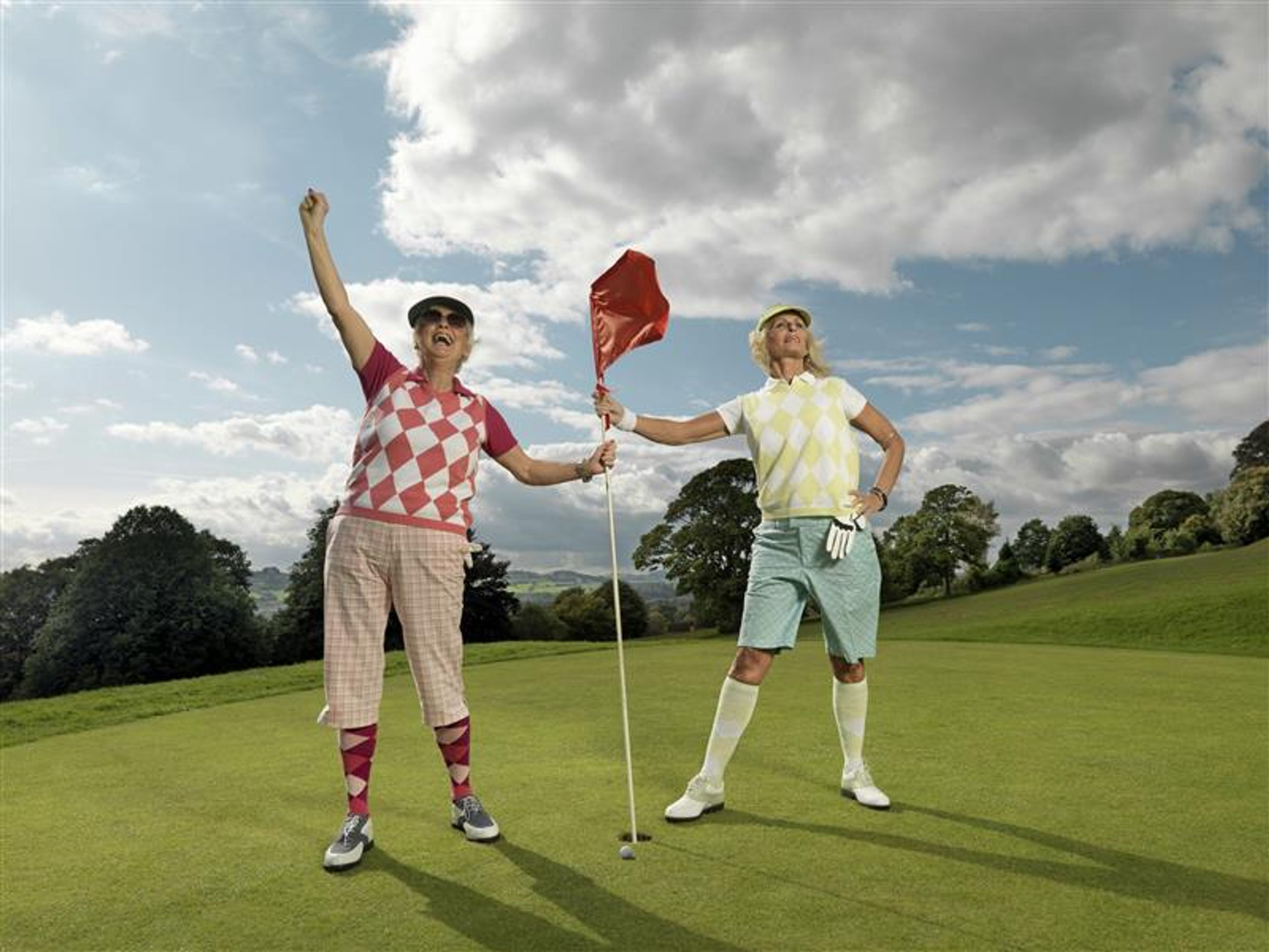 Mature ladies playing golf