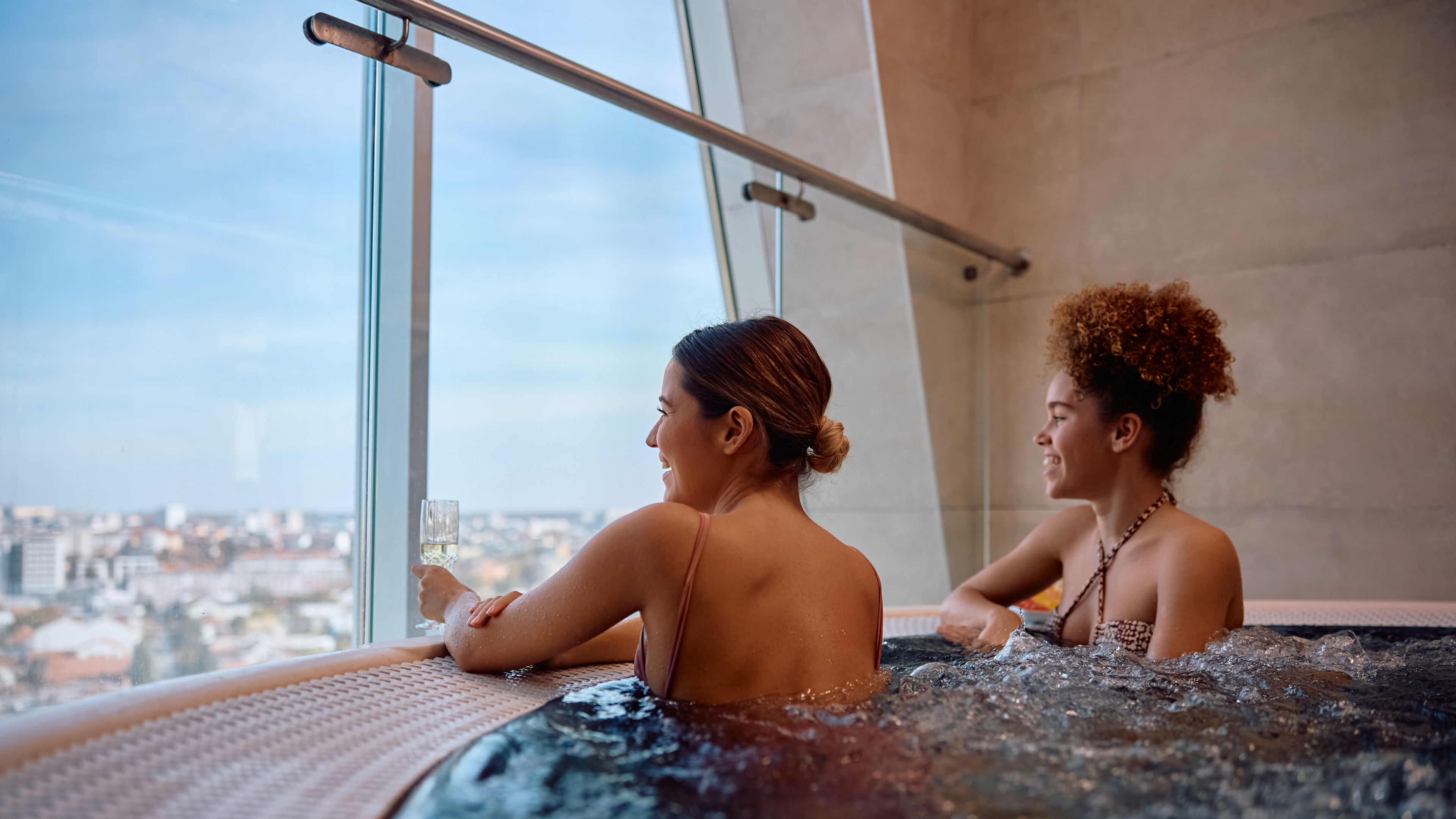 Young happy women in Jacuzzi